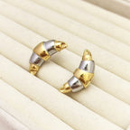 Boucles d'oreilles bicolores or et argent détail finition brillante