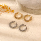 Créoles volumineuses texture maille tressée finition or et argent 