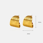 Créoles striées lumineuses plaqué or 18K détail texture brillante