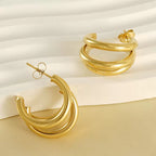 Créoles triple anneaux finition or design minimaliste élégant